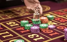 BetUS casino presented on mobile device in Pakistan with slots and live games